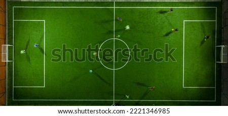 Aerial view of a mini football match, soccer. MiniFootball field and Footballers from drone