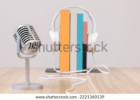 Microphone, headphone on books. Reading audiobooks for the visually impaired concept