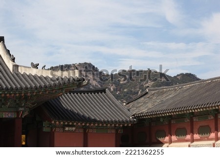 Korean traditional roof and beautiful blue sky
The words written on the wooden board are 'GiByeolCheong'.