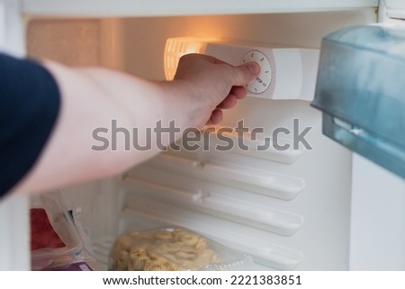 Save electricity by lowering refrigerator power - cooling mode Royalty-Free Stock Photo #2221383851