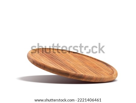 Round wooden pizza board falling on a white background. Food preparation. Culinary background. Royalty-Free Stock Photo #2221406461