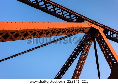 Red Bridge in Portland. Farms metal vehicular and pedestrian bridge painted red. The Broadway Bridge is a Rall-type bascule bridge spanning the Willamette River in Portland, Oregon built in 1913. Royalty-Free Stock Photo #2221414221