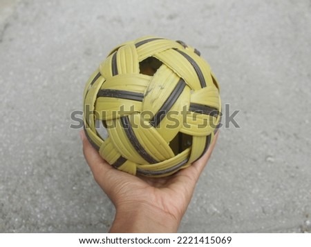 Sepak takraw, takraw ball in hand with hands ready to be played