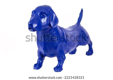Abstract pastel background image made of blue decorative dog statue composition on white backdrop buying.
