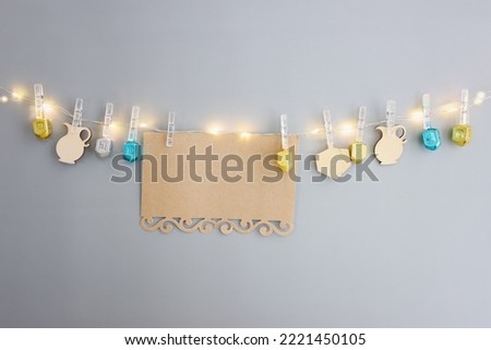 Image of jewish holiday Hanukkah and wooden dreidels collection. Spinning tops with letters that mean, a great miracle happened here