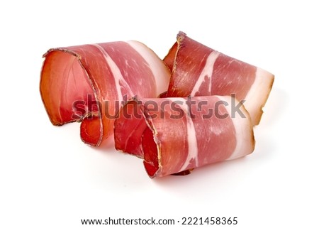 Italian prosciutto crudo or spanish jamon. Jerked meat, isolated on white background Royalty-Free Stock Photo #2221458365