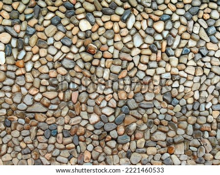 Stone pattern on the wall with many colors, grey, brown, yellow, white, black. Royalty-Free Stock Photo #2221460533