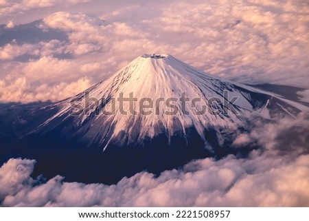 Panoramic plane view of beautiful sunset in the sky over clouds and Mount Fuji, Japan Royalty-Free Stock Photo #2221508957