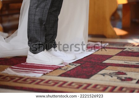 the newlyweds are standing on a towel in the church