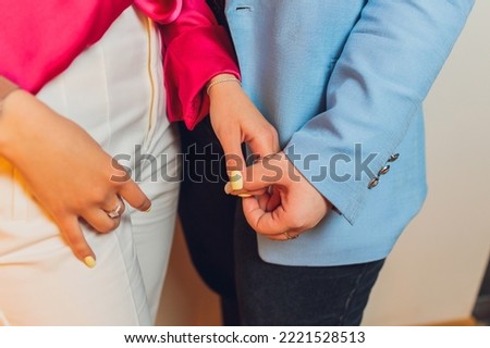 Women and men are couples holding hands together blur the background, Giving feelings of love happiness, Take pictures in the close-up shot of little finger view.