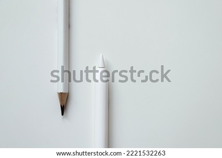 electronic stylus and wooden plain pencil, technology development concept and new generation