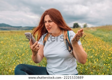 No signal cellphone network. No communication coverage, lost contact signal device. Angry woman tourist hiker hand holding smart phone searching signal. Communication, cellular problem, bad connection Royalty-Free Stock Photo #2221533889