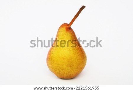 Ripe attractive red-yellow pear on a white background.
