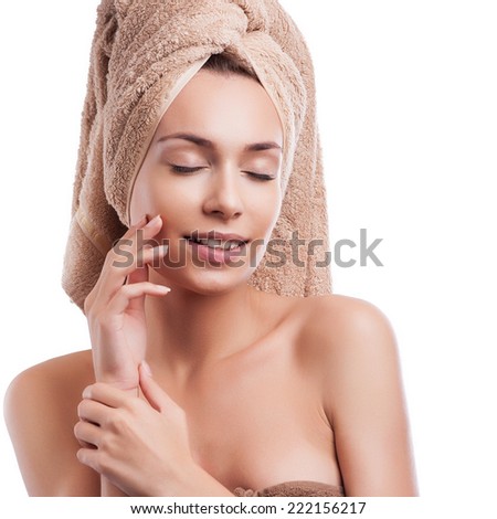 Spa skin care beauty woman wearing hair towel after beauty treatment. Beautiful multiracial young woman with perfect skin isolated on white background.