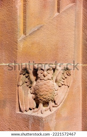 Owl carved in stone on the round arch of a window of the New Town Hall in Rathausgasse, Freiburg im Breisgau, Baden-Wurttemberg, Germany.