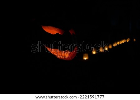 Halloween pumpkin on holiday night. Carved pumpkin. Dark background.