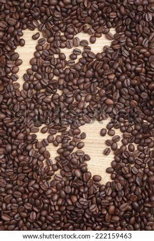 Caffe edition, coffee beans on a wooden background
