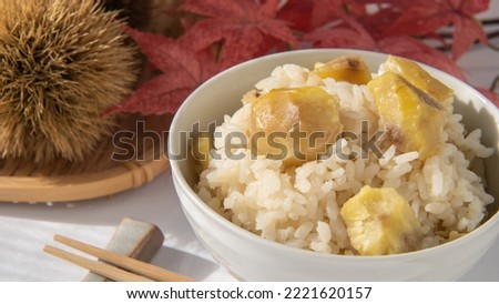 Steamed chestnut rice on the table.Chestnut rice is a Japanese autumn food. Royalty-Free Stock Photo #2221620157