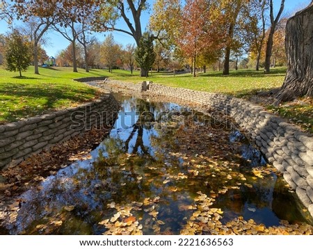 Looking over the stream in Heartwell Park Royalty-Free Stock Photo #2221636563