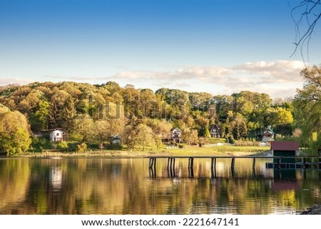 
Panorama of Sotsko Jezero, or lake Sot, in Fruska Gora, in Serbia, Europe, in summer, at dusk, into the light with cabins, holiday houses. it is a major natural landmark of Vojvodina. 


 Royalty-Free Stock Photo #2221647141