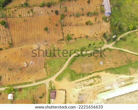 Abstract Defocused Blurred Background Aerial view of agricultural fields along mountain slopes in northern Cikancung - Indonesia. Not Focus