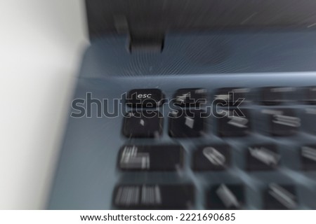 out of focus or zoom blur effect of esc key button on laptop