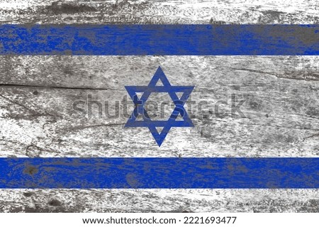 Israel flag painted on a damaged old wooden background