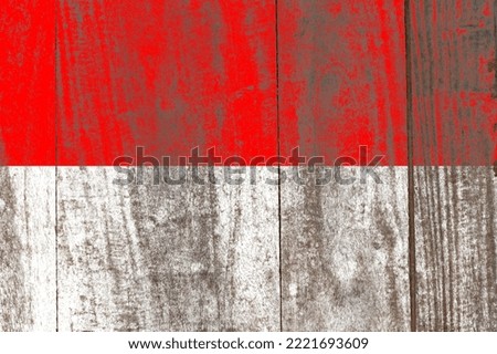 Indonesia flag painted on a damaged old wooden background