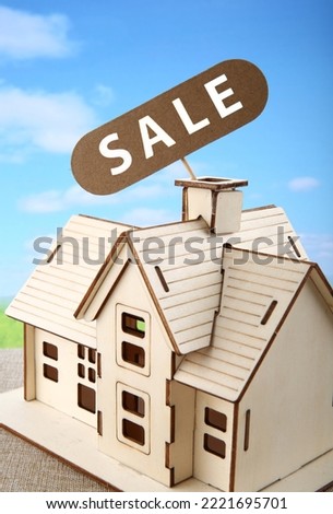 House for sale, house model on sale with hang tag or real estate home and commercial building, Loan business finance economy commercial real estate investments concept.