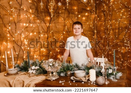 ten-year-old boy standing at the Christmas table