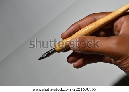 wooden pens with various detachable metal nibs for various purposes, school pens for writing, g pens for drawing comics, and maru pens for calligraphy or blocking. Pen for drawing japanese comics