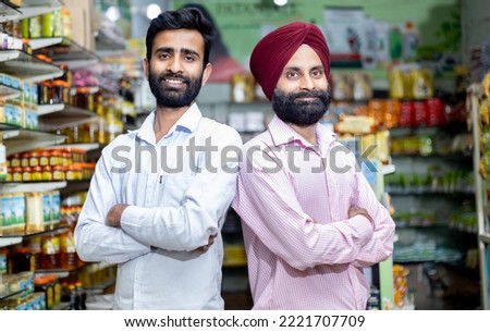 portrait of confident Indian  grocery store owner  Royalty-Free Stock Photo #2221707709