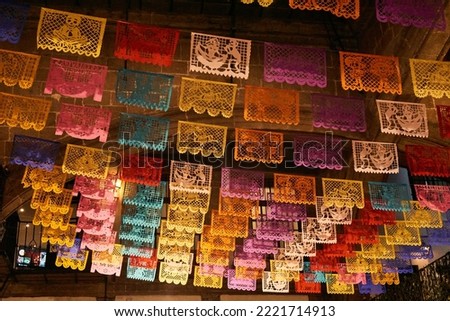 Colorful tissue paper cut-out flags "papel picado" for the day of the dead in mexico Royalty-Free Stock Photo #2221714913