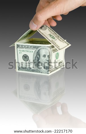 building by the hand of house from a money