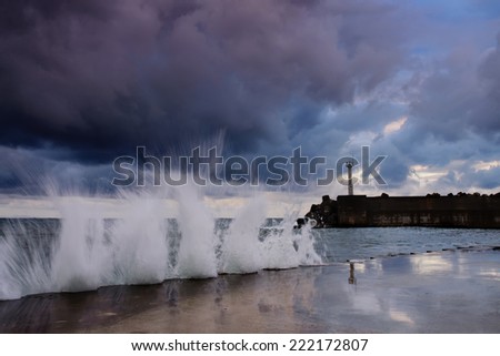 storm on the sea.lighthouse.long exposure was used to capture the image.