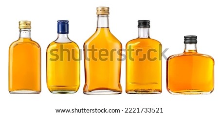 Set of Full small flat bottles of whiskey isolated on white background  Royalty-Free Stock Photo #2221733521