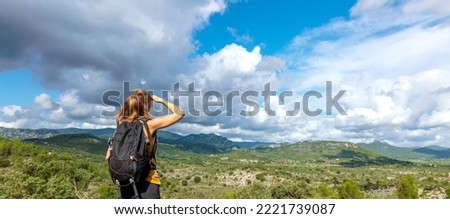 hiker woman tourist looking at Cevennes nature in France Royalty-Free Stock Photo #2221739087