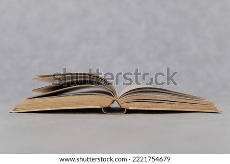 Open book on grey background