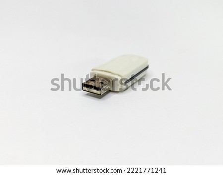 Card reader mmc sd card to transfer data.  Isolated on a white paper background.