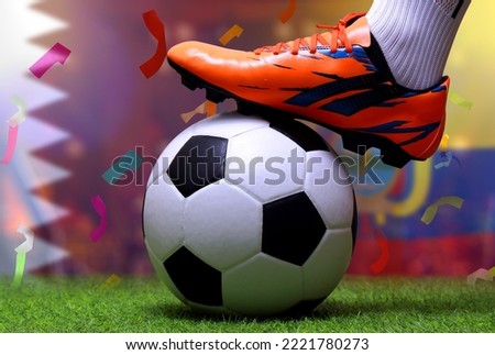 Close up legs and feet of soccer player or football player walk on green grass ready to play match on national Qatar and national Ecuador.