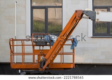 cradle construction hoist on the background of the house. construction hoist. High quality photo