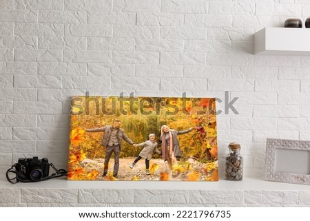 photo canvas with a family in autumn