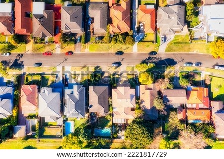 Local green residential suburbs in Sydney West - aerial top down view over quiet street with houses. Royalty-Free Stock Photo #2221817729