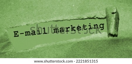 E-mail marketing inscription under torn paper. Digital marketing business concept.
