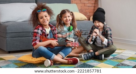 Band of little musicians playing at home