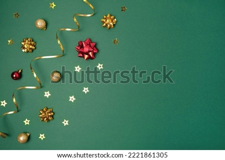 New Year Green Background. Golden Decoration. Christmas Greeting Card Mockup. Sparkle Baubles. Top view, Copy Space. Gold Balls, Confetti on Dark Green Festive Backdrop. Banner Template. Xmas Frame.