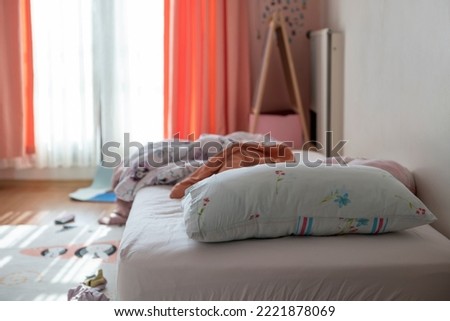 A messy teen bed and its surroundings Royalty-Free Stock Photo #2221878069