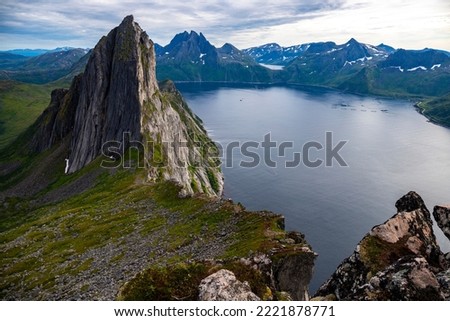 the famous view of segla mountain as seen from the hesten trail, senja, norway; the mighty mountain in the norwegian fjord Royalty-Free Stock Photo #2221878771