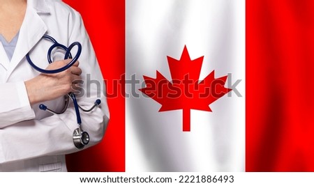 Canadian medicine and healthcare concept. Doctor close up against flag of Canada background