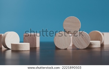 Stacking blank wooden cubes on blue background with copy space for input wording and infographic icon. Empty brown wooden object block for symbol icon put technology, zero gravity, business concept.